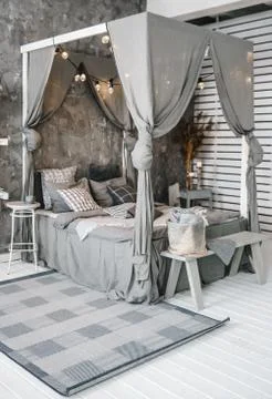 Large bed four-poster bed. Bedroom design Stock-Fotos