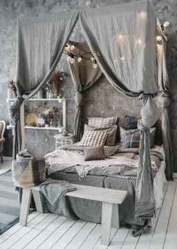 Large bed four-poster bed. Bedroom design Stock-Fotos