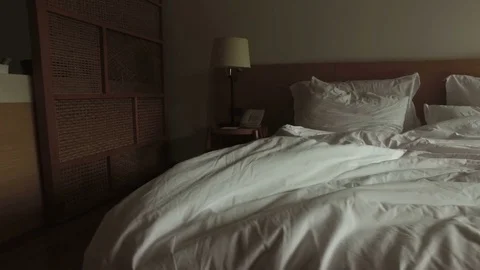 Large bed with white linen Video stock 85281420