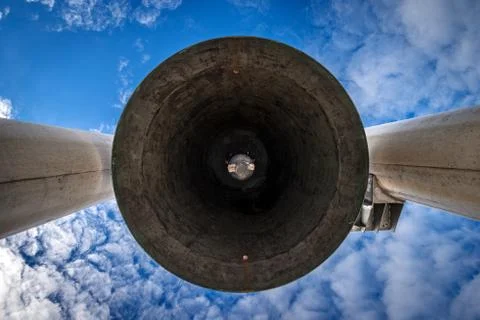 Large Bell with Clapper on Blue Sky with Clouds - Low Angle View Stock Photos