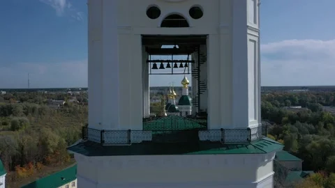 Large bell tower with clock against church with golden domes Stock Footage 152923527