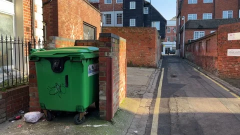 Large bin container and a back street in England Stock Footage 231043892