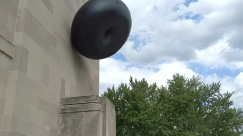 Large Black Donut Art Decor Side of Building Stock-Footage 137687961