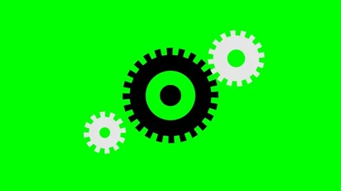 A large black gear flanked by two smaller white gears on a green screen Stock Footage 340264921