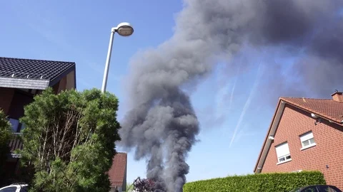 Large Black Smoke Clouds, Fire in Town Stock Footage 98352860