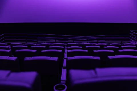 Large blank white cinema screen in dark modern movie theater Stock Photos