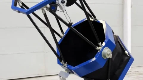 A large blue and black truss tube dobsonian telescope assembly. Stock Footage 321793515