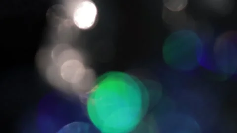 Large blue and small gold bokeh light shines in the background. Video stock 317448042