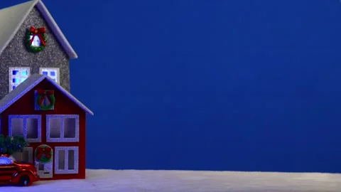 On a large blue background there are houses and a red car Stock Footage 294492172