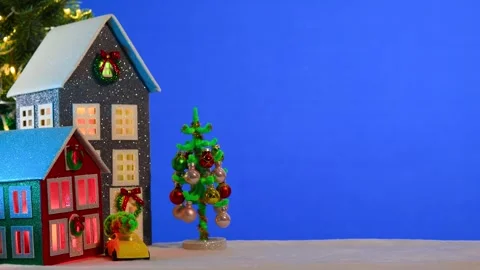 On a large blue background there is a gray and red house with a yellow car Stock Footage 294322751