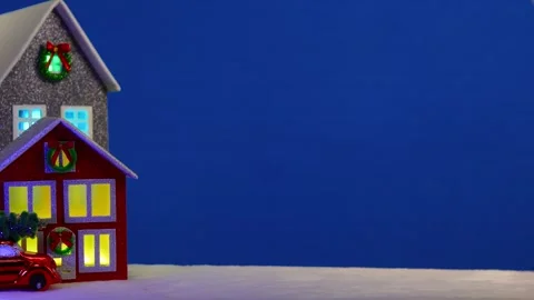 On a large blue background there is a grey and red house with a red car Stock Footage 294492145