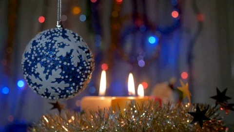 A large blue ball hangs on the Christmas tree. New Year and Christmas Stock Footage 83148992