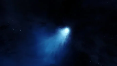 Large blue comet with long tail against a star and nebula backdrop. Comet enter Stock Footage 250070483