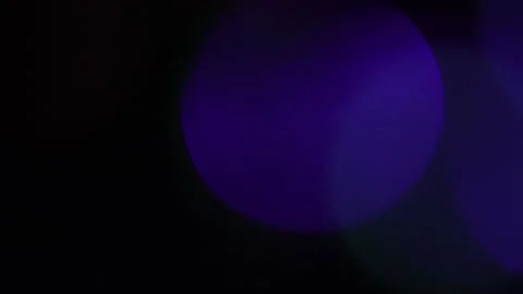 Large blue diffused bokeh on a black background Video stock 318918398