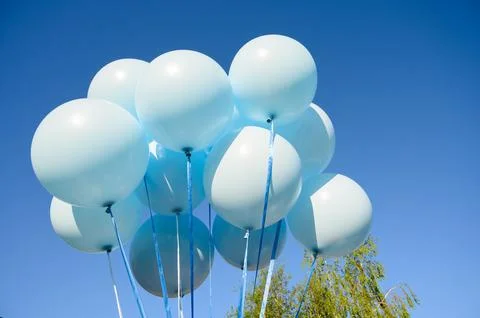Large blue inflatable balloons with weights Stock Photos