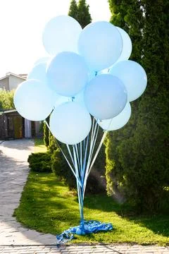 Large blue inflatable balloons with weights Stock-Fotos