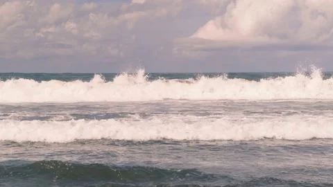 Large blue ocean waves curl into a tube off the coast of the island of Bali 動画素材 183479212