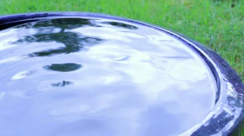 Large blue pot full of waving water Stock Footage 54562406