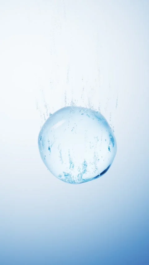 Large blue water drop falling through liquid with trail of rising bubbles i.. Stock Footage 332222866