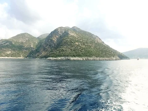 Large boat's engine propellers churning the sea into big waves Stock Footage 80053207