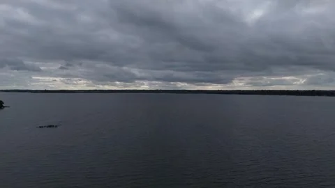 A large body of water with a cloudy sky Stock Footage 328536363