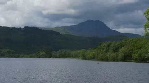 A large body of water with a mountain in the background Stock Footage 155590599