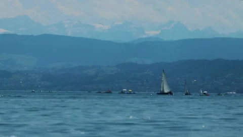 A large body of water with a mountain in the background Stock Footage 156011898