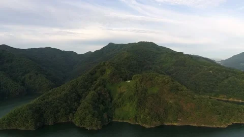A large body of water with a mountain in the background Stock Footage 156341469