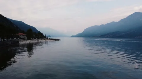 A large body of water with a mountain in the background Stock Footage 209860823