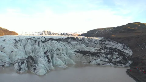 A large body of water is surrounded by a mountain range Stock Footage 301796693