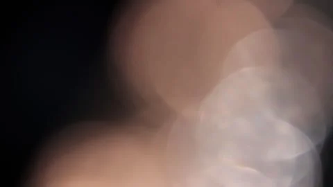 Large bokeh lights shining on the right in the darkness Stockbeeldmateriaal 318637302