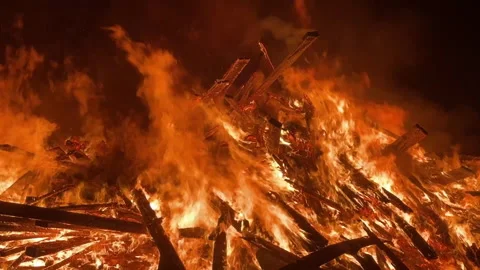 Large Bonfire Blazing at Night with Smoke and Glowing Embers in Killarney Stock Footage 336416914