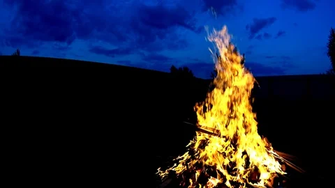 Large bonfire on dark background, low angle shot Stock Footage 74852199
