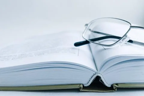 A large book is open on the table Stock Photos