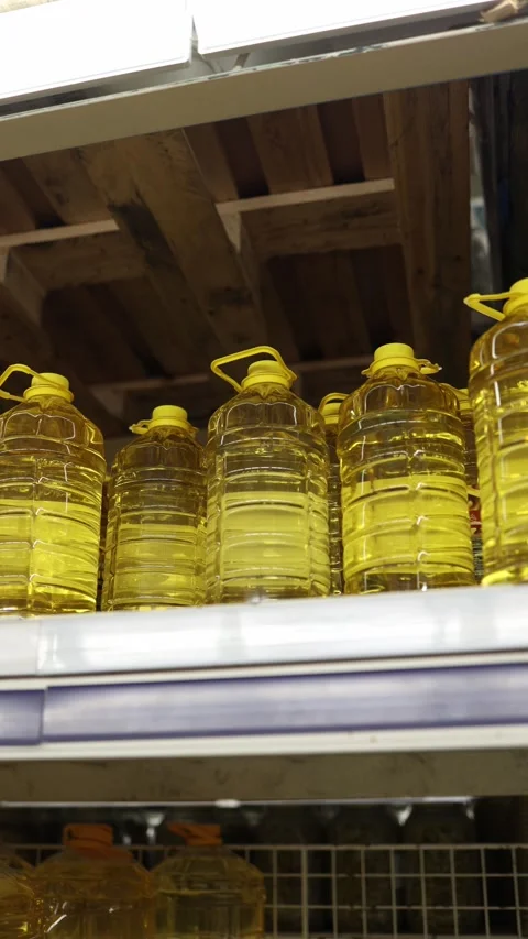 Large bottles of vegetable cooking oil displayed on wholesale store shelves Stock Footage 345977843