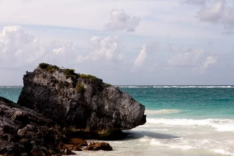Large Boulder on a Caribbean Beach Left Stock Photos
