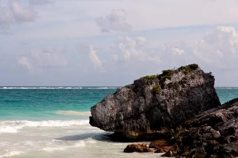 Large Boulder on a Caribbean Beach Stock Photos