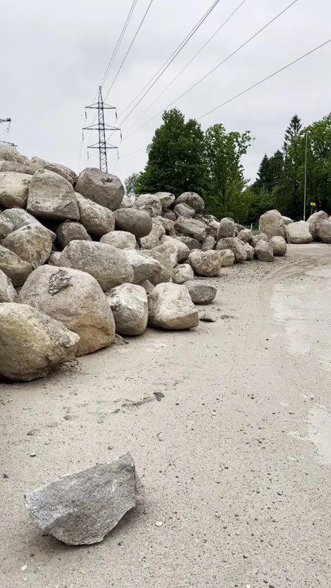 Large Boulder Stockpile Along Construction Access Road Stock Footage 341569195