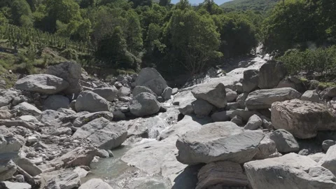 Large boulders in a flowing river bed Stock Footage 288728632