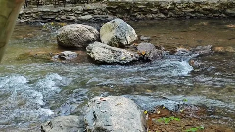 Large boulders in a rushing river stream. Stock Footage 341263537