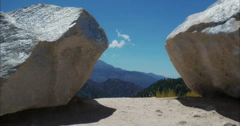 Large Boulders Under Clear Blue Sky in Mountain Landscape Stock Footage 323596114
