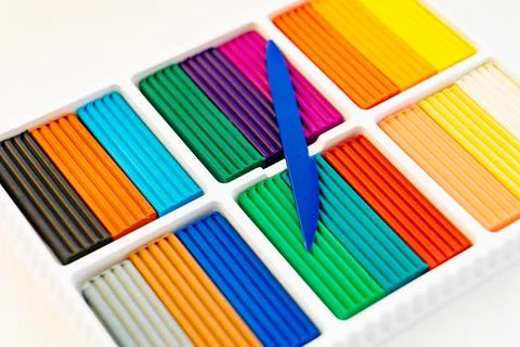 Large box with multi-colored plasticine. stationery store for schoolchildren. Stock Photos