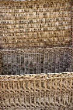 Large box of willow twigs to store clothes. Close-up Stock Photos