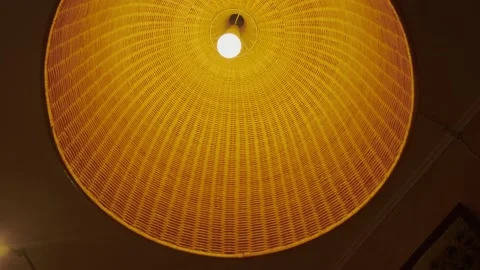 Large braided lampshade with a light bulb Stock Footage 227028784