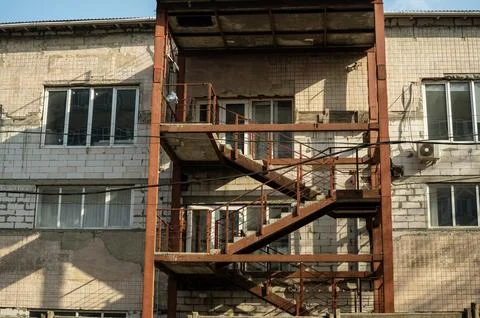 A large brick building with many windows Stock Photos