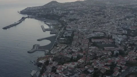 A large brick building with a mountain in the background Stock Footage 156333976