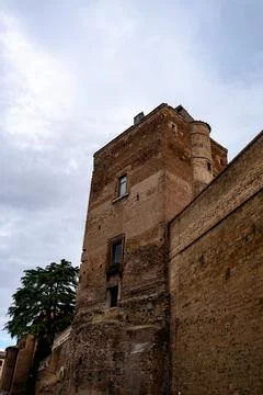 A large brick building with a window on the side Stock Photos