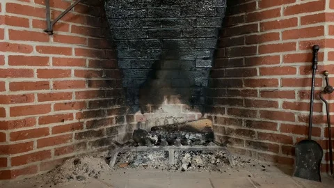 Large brick fireplace stained black Stock Footage 124509727
