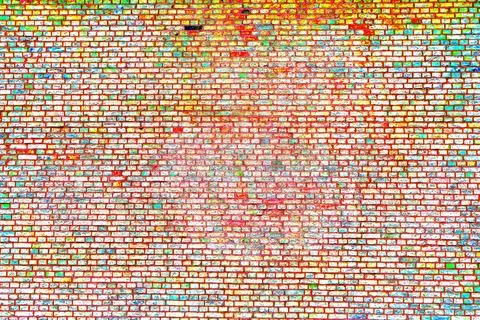 Large brick wall, uneven, broken and black burnt brick, bright brick backgrou Stock Photos