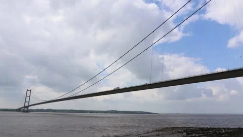 Large Bridge With Passing Traffic Over The Wide River (Humber Bridge, England) Stock Footage 294073934
